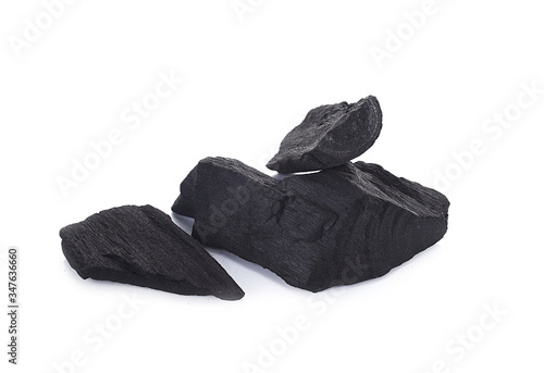 Natural wood charcoal, traditional charcoal or hard wood charcoal isolated on white background © TANAPAT