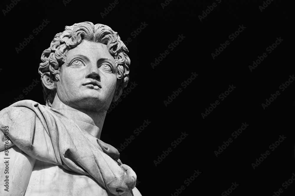 Ancient marble statue of mythical character Castor or Pollux, dated back to the 1st century BC, located at the top of monumental balustrade in Capitoline Hill in Rome (Black and White with copy space) Ancient marble statue of mythical character Castor or Pollux, dated back to the 1st century BC, located at the top of monumental balustrade in Capitoline Hill in Rome (Black and White with copy space)
