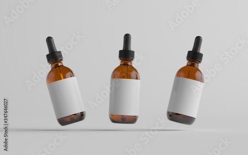 фотографія Amber Glass Dropper Bottle Mockup - Three Bottles. Blank Label