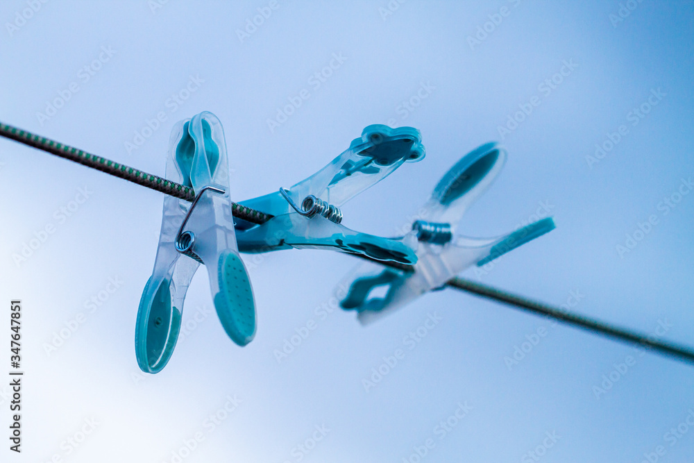 Pegs on washline over the sky Pegs on washline over the sky