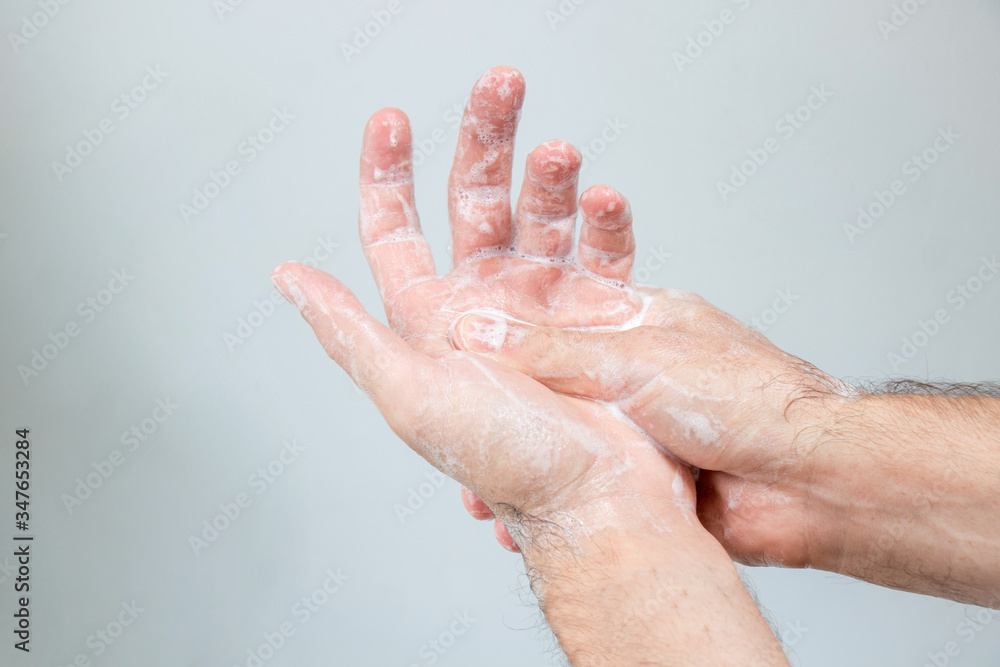 Washing hands rubbing with soap man for coronavirus, hygiene and desinfecton for prevention. Lock down, covid19. Antibacterial. Alcohol gel Washing hands rubbing with soap man for coronavirus, hygiene and desinfecton for prevention. Lock down, covid19. Antibacterial. Alcohol gel