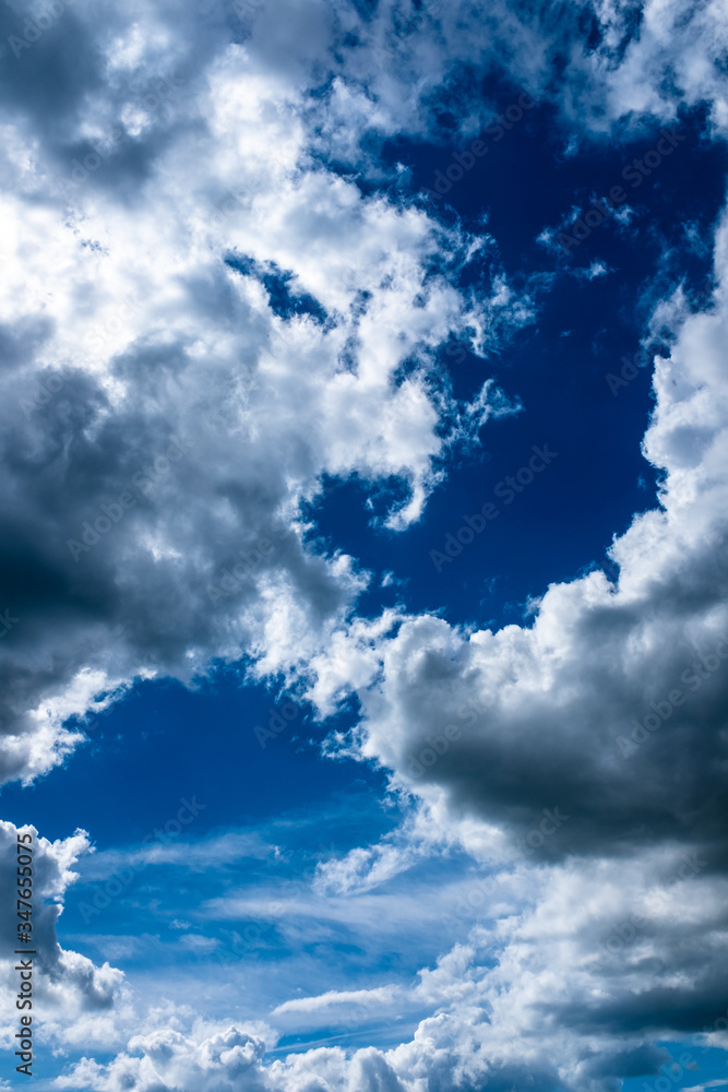 Spring cloudy deep blue sky