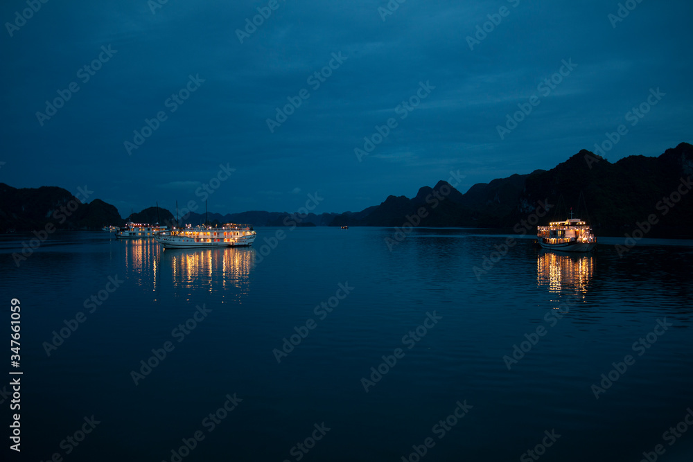boats at night in Halong bay boats at night in Halong bay