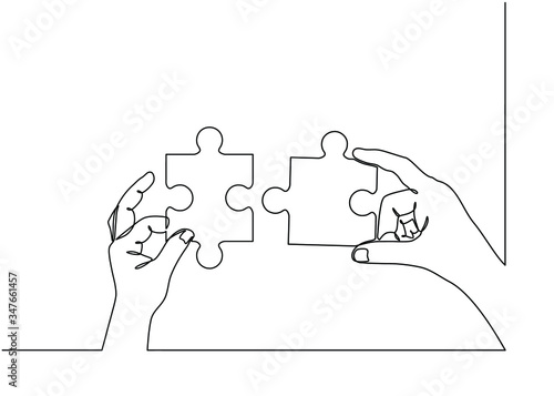 Continuous line drawing of hands solving Two Puzzle Pieces. Concept of business teamwork and integration with puzzle. Teamwork and partnership concept of two businessman isolated on white background.