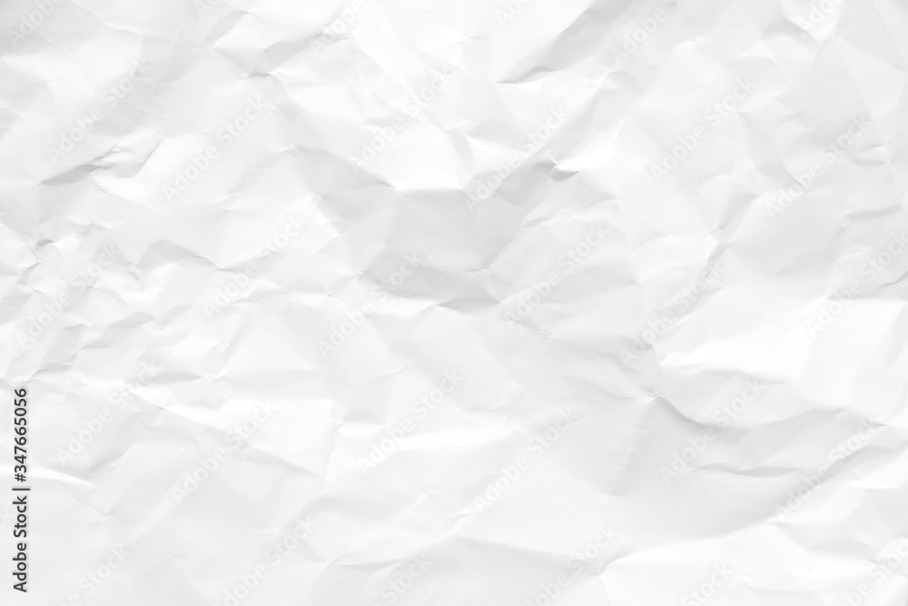 White crumpled paper texture background. Clean white paper. Top view. White crumpled paper texture background. Clean white paper. Top view.