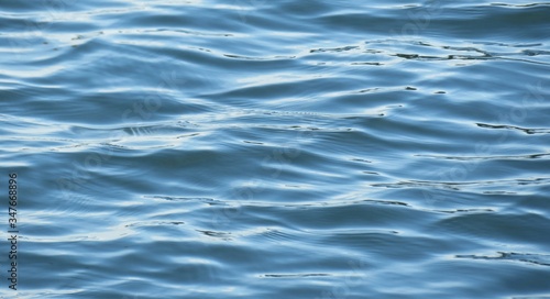 Beautiful light blue   merald water surface with soft waves on Florida river  natural water background 