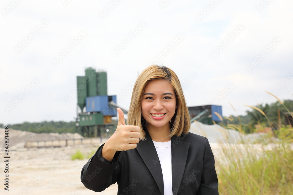 Asian woman chinese malay worker engineer management at construction site thumbs up Asian woman chinese malay worker engineer management at construction site thumbs up