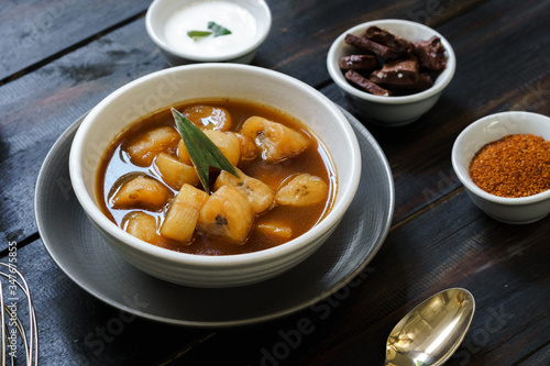 Banana Compote served with pandan leaf on the ceramic bowl. photo