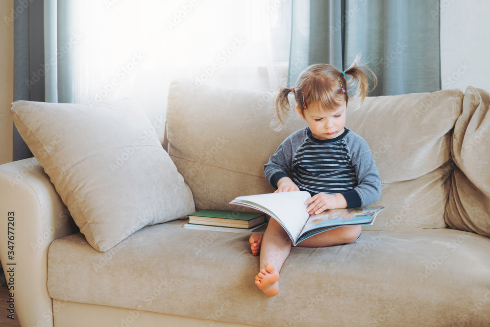 Girl reading at home. Girl reading at home.