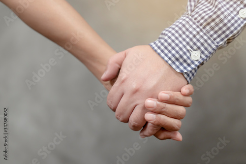 Couples holding hands together and ready to walk together, romantic atmosphere, propose marriage proposal, Valentine's Day and Family Day ideas