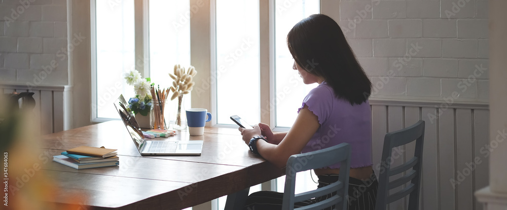 Business women work from home living room enjoying sunny morning on the day with documents and laptop people Consulting and business planning. Business women work from home living room enjoying sunny morning on the day with documents and laptop people Consulting and business planning.