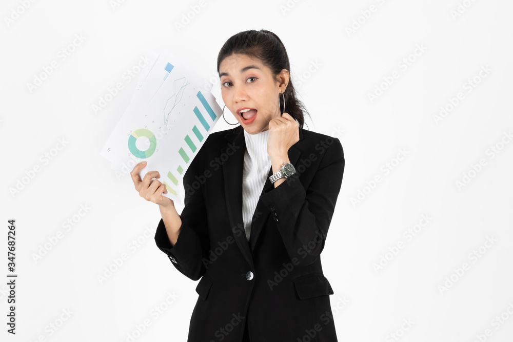 Successful young Asian business woman holding charts or paper work and raising hands over white isolated background. Successful young Asian business woman holding charts or paper work and raising hands over white isolated background.