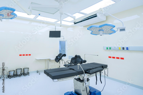 Empty adjustable patient's bed in the maternity ward at hospital photo