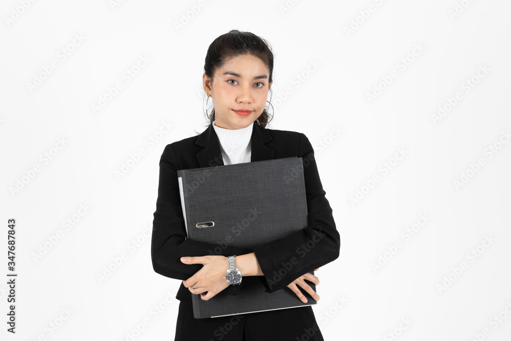 Portrait of confident young Asian business woman in suit hold document folders or ring binder on white isolated background Portrait of confident young Asian business woman in suit hold document folders or ring binder on white isolated background