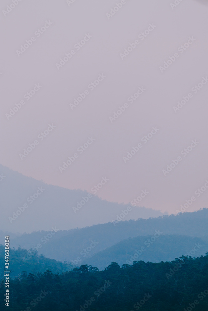 blue hour over the mountains in Tasmania with different layers of mountain ranges in the distance