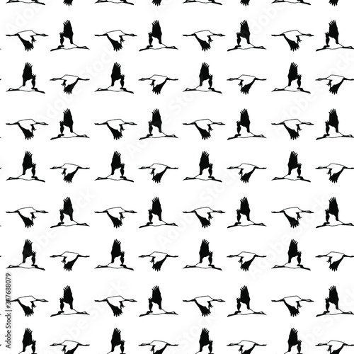 Seamless pattern with cranes - birds fly across white background