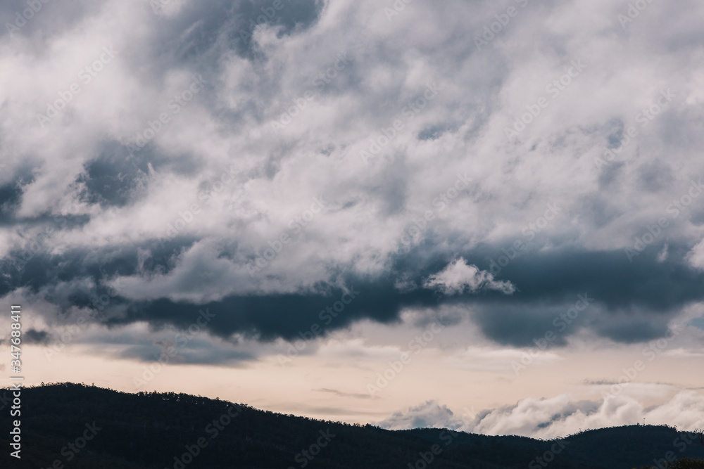 stormy clouds rolling over the mountains in Tasmania stormy clouds rolling over the mountains in Tasmania