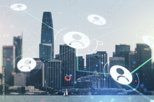 Double exposure of social network icons hologram on San Francisco office buildings background. Networking concept
