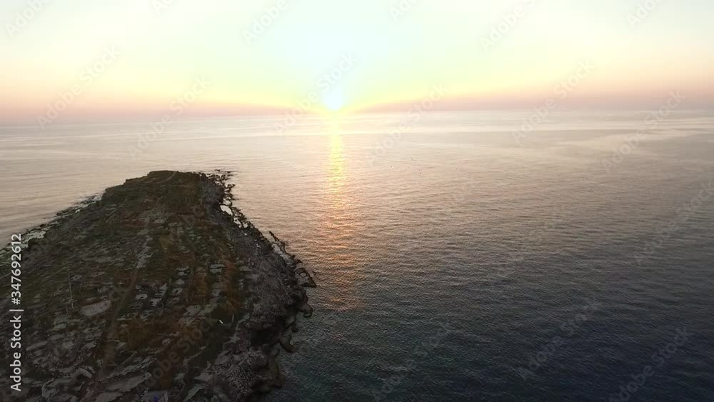 Stunning bright white and yellow sun on ocean horizon, Anfeh beach, Lebanon Stunning bright white and yellow sun on ocean horizon, Anfeh beach, Lebanon