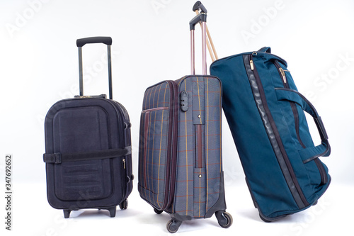 Bag and two suitcases on wh...