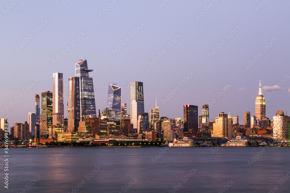 Beautiful view of New York city skyline with waterfront at evening, USA