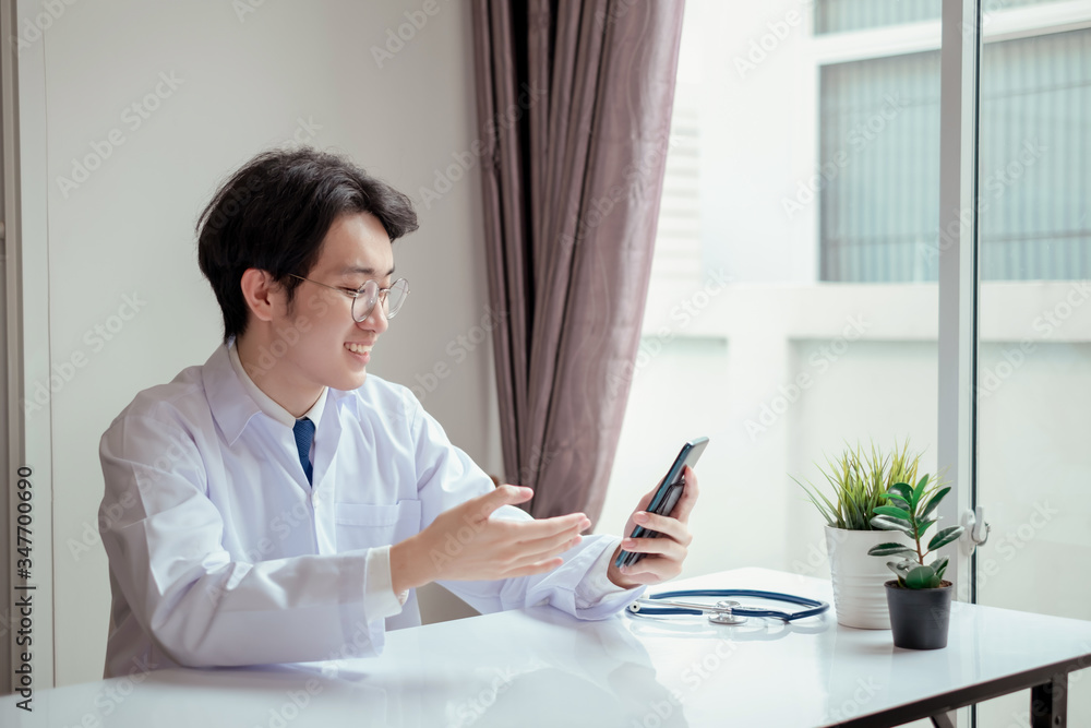 Asian doctor video conference with woman patient care discussing and consultant for medical coronavirus video call user interface healthcare online service remotely talking when quarantine at home. Asian doctor video conference with woman patient care discussing and consultant for medical coronavirus video call user interface healthcare online service remotely talking when quarantine at home.