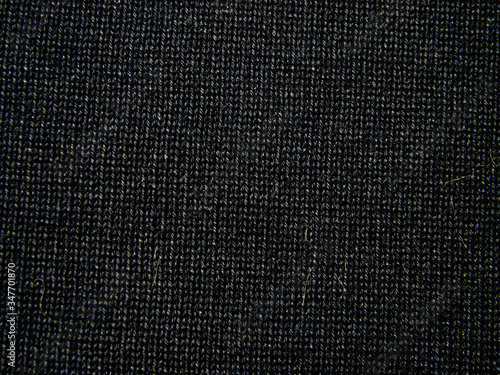 Dark structural background made of cotton fabric