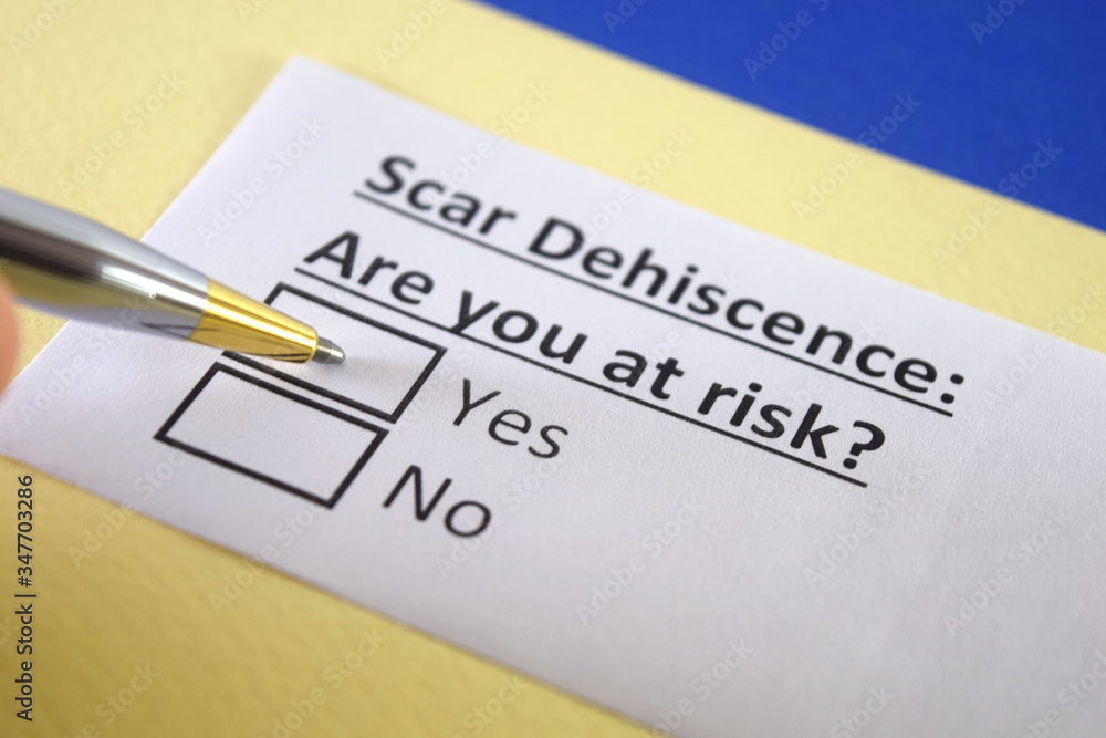 One person is answering question about scar dehiscence.
