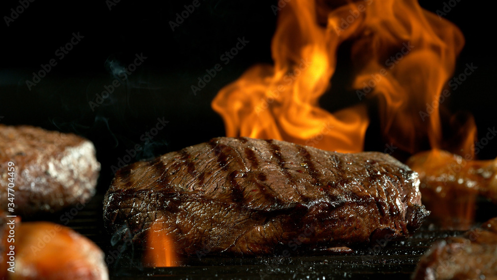 Raw beef burger steak on grill