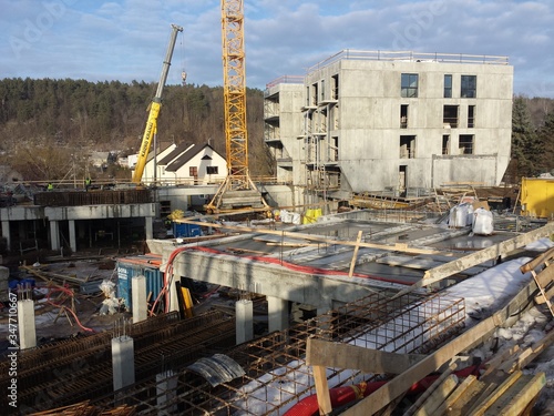 Apartment buildings construction site with cranes