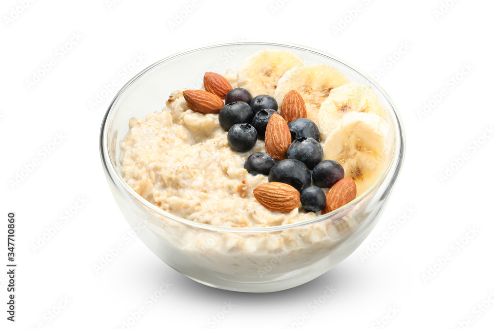 Bowl with oatmeal porridge and ingredients isolated on white background Bowl with oatmeal porridge and ingredients isolated on white background