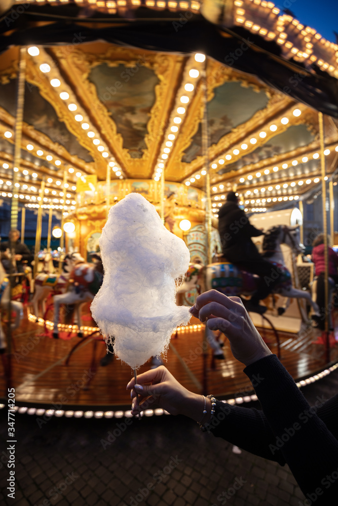 A cotton candy in front of an ancient German Horse Carousel built in 1896 in Navona Square, Rome, Italy