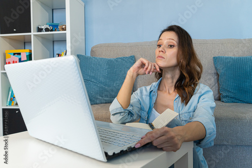 Beautiful young woman working from home. Work in home office. Stay at home concept.