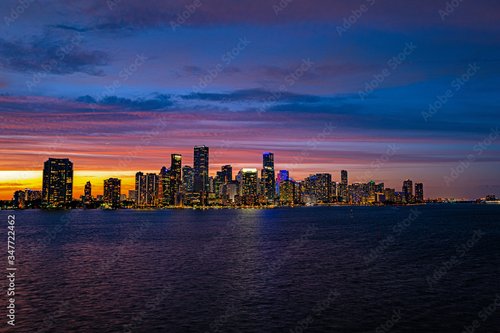 Miami Florida, skyline of downtown night colorful skyscraper buildings. Miami city, Florida skyline panorama at dusk with urban skyscrapers.  Business district Miami.