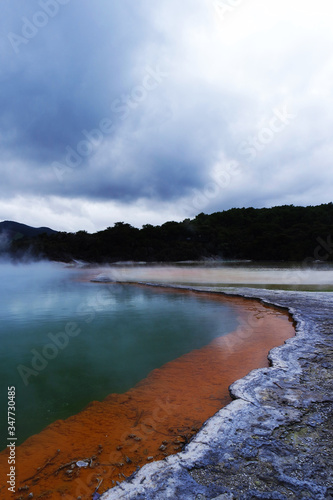 Geothermal lake with an orange shoreline