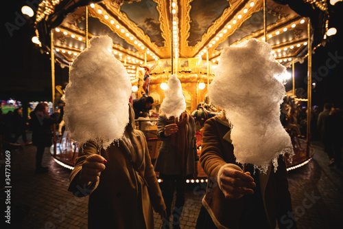 Canvas Print A cotton candy in front of an ancient German Horse Carousel built in 1896 in Nav