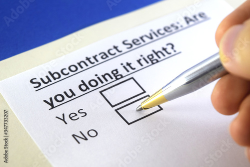 Photos One person is answering question about subcontract services.