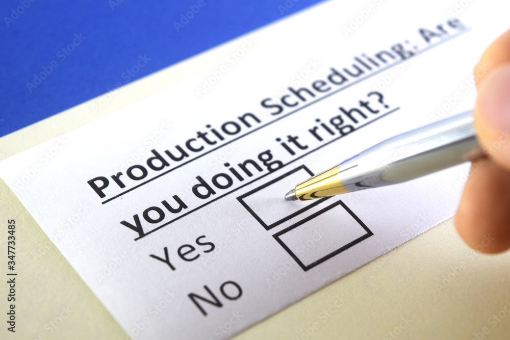 One person is answering question about production scheduling. One person is answering question about production scheduling.