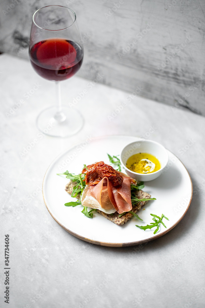 iberico ham sandwich on marble background with copy space