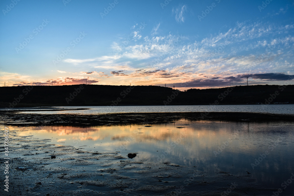 Sunset in the shallow sea