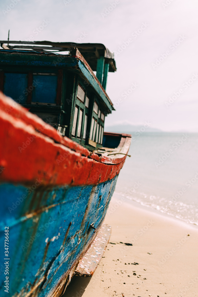 Old fishing boat, rust on the hull. A traditional Asian fishing boat. Travel in Vietnam