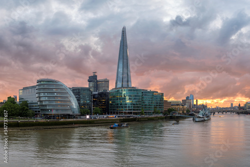 London skyline along the Thames river during sunset time, London, United Kingdom.