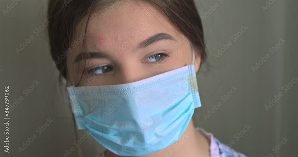 Young woman wearing medical face mask sitting together with her dog in home. Quarantine Coronavirus concept, covid-19. High quality video 4k resolution Young woman wearing medical face mask sitting together with her dog in home. Quarantine Coronavirus concept, covid-19. High quality video 4k resolution