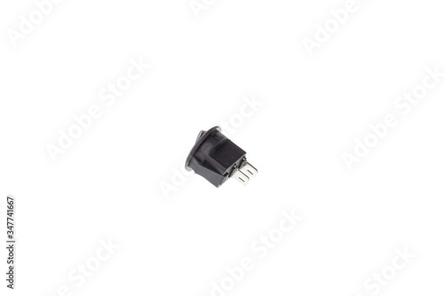 Back view of round two position black push toggle switch, isolated on white background