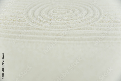 Abstract Zen drawing on white sand. Concept of harmony  balance and meditation  spa  massage  relax. Zen garden.