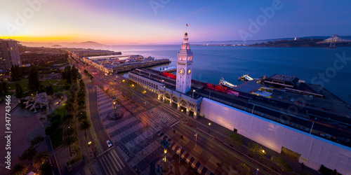 San Francisco Skyline and Ferry Building at Sunset with City Lights - Empty During Shelter in Place Quarantine photo