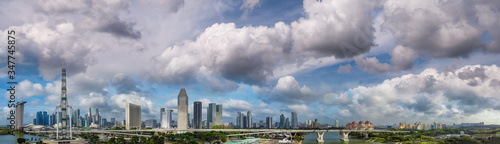 Panoramic aerial view of Singapore skyline from a drone point of view at dusk