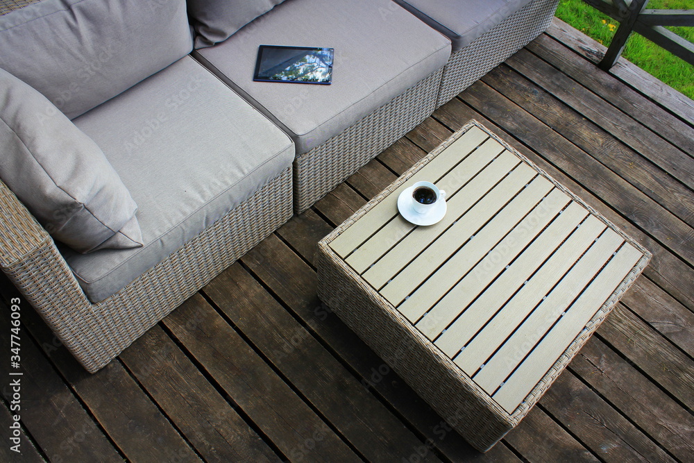 Outdoor furniture lounge group with chairs, sofa and table in a patio ...