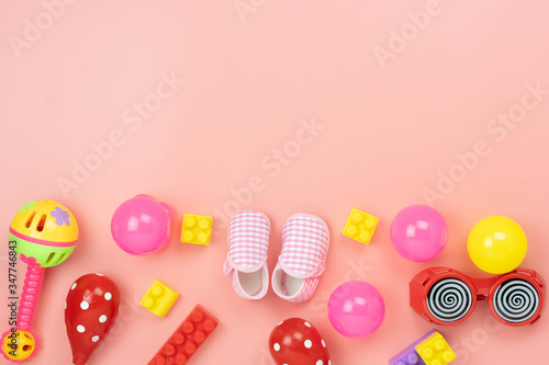 Table top view decoration kid toys for develop background concept.Flat lay accessories baby to play with items child on modern pink paper at office desk.Copy space for add text.pastel tone wallpaper.