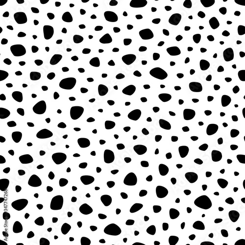 Background polka dot. Seamless pattern. Random dots, circles, animal skin. Design for fabric, wallpaper. Irregular random abstract texture with dots. Modern stylish texture. Repeating graphic backdrop